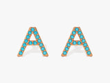 Rose gold letter A earrings with blue gemstones