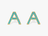 Gold letter A earrings with blue gemstones