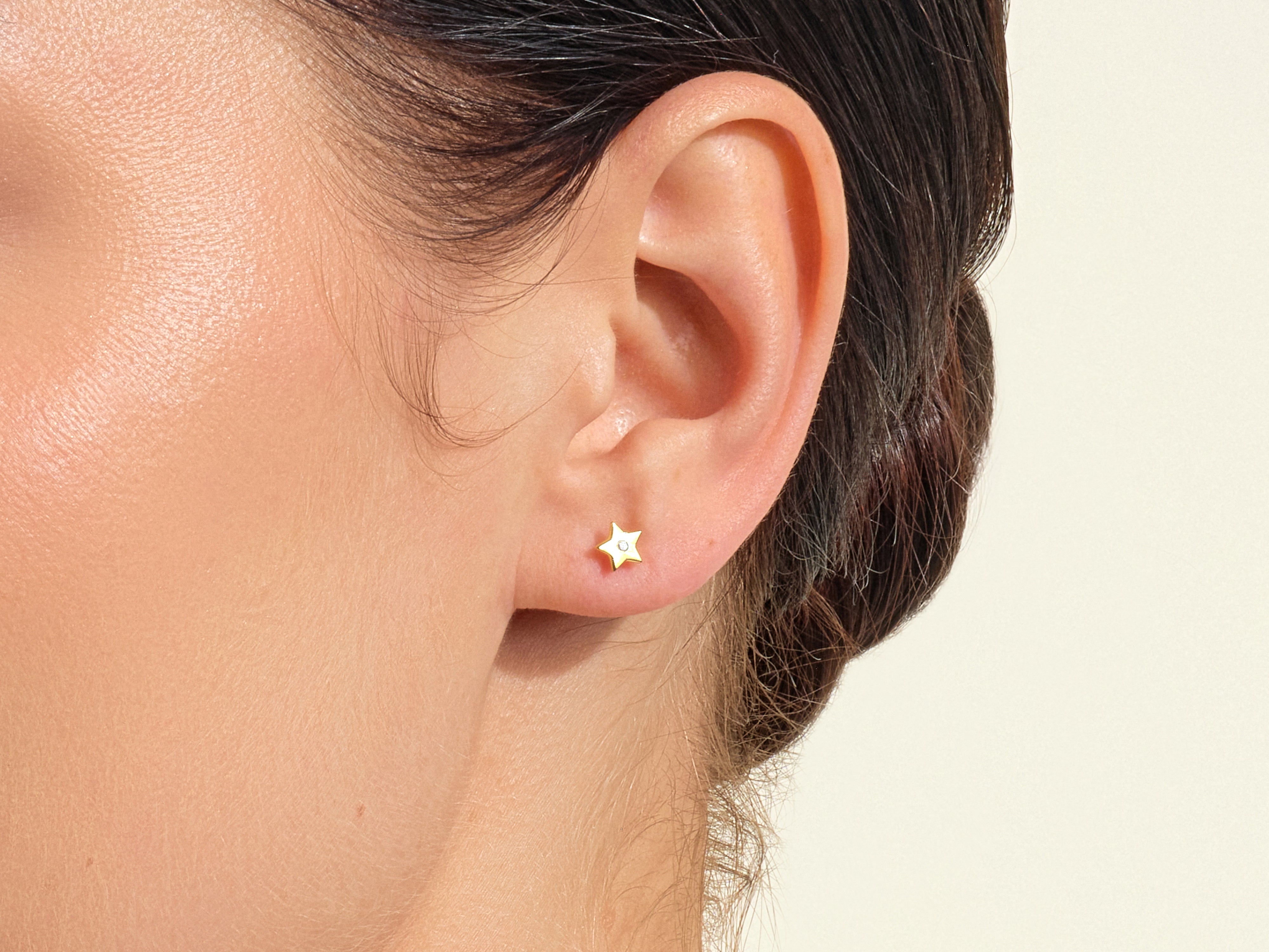 Gold star stud earring with diamond accent from jewelry collection