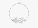 Silver chain bracelet with two delicate flower charms