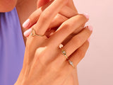 Elegant gold rings with diamonds on a woman's hand