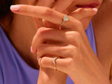 Gold rings with diamonds on a woman's hand