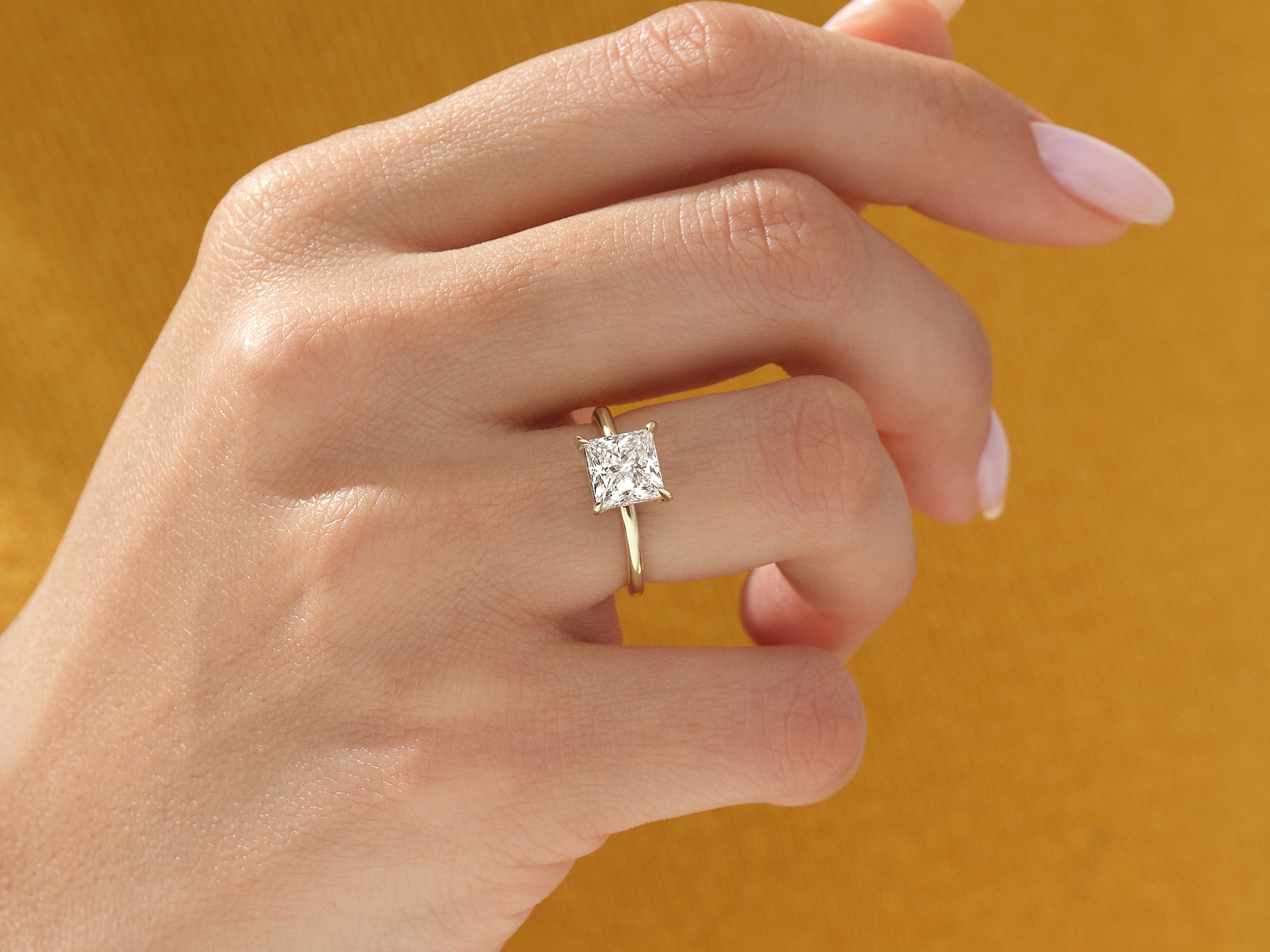 Princess cut diamond ring on a woman's hand