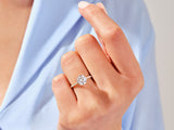 Gold diamond engagement ring on a woman's hand