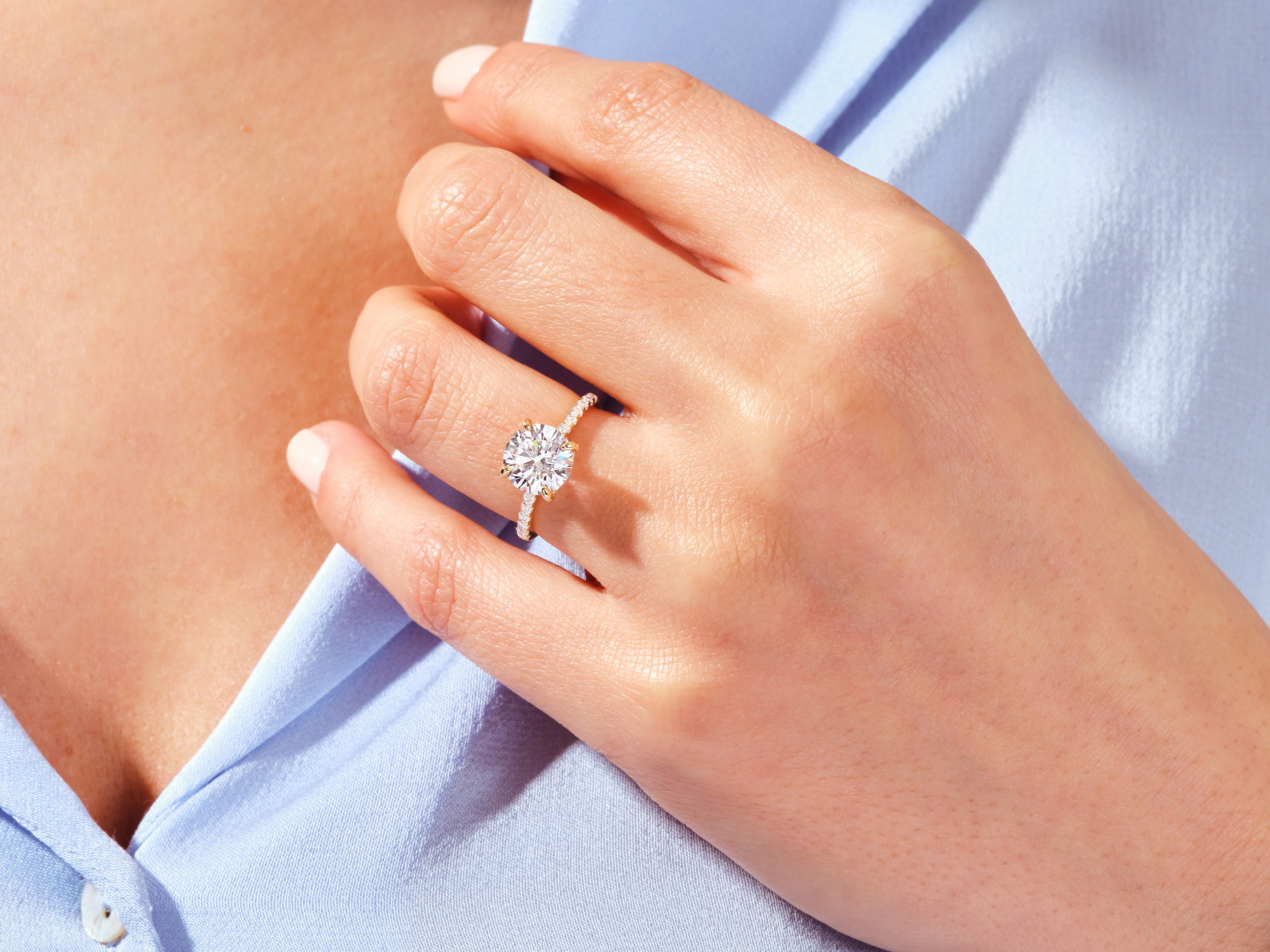 Diamond engagement ring on a woman's hand, jewelry
