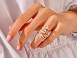 Diamond engagement rings on a hand, jewelry collection