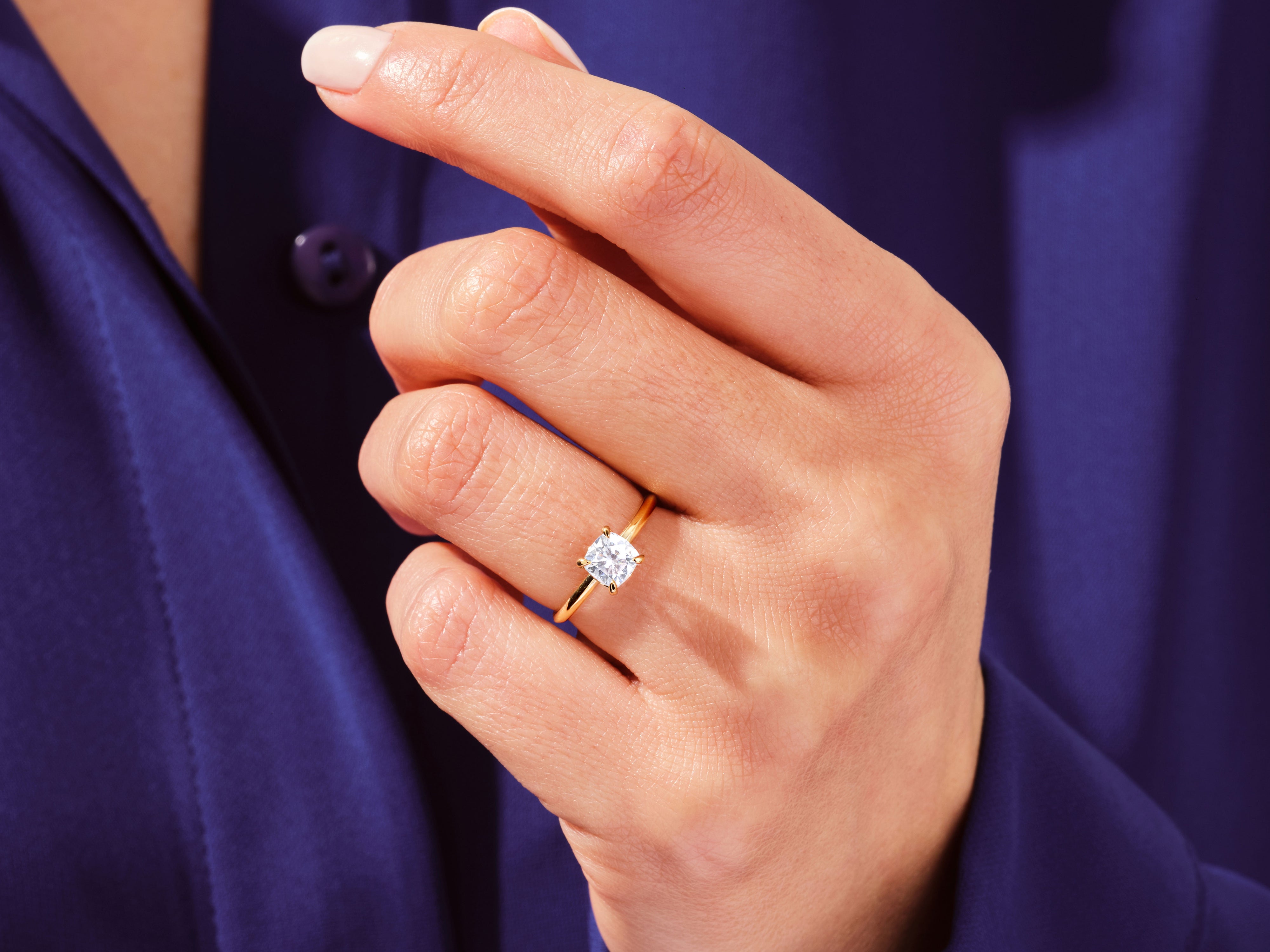 Gold ring with diamond on hand, jewelry product photography