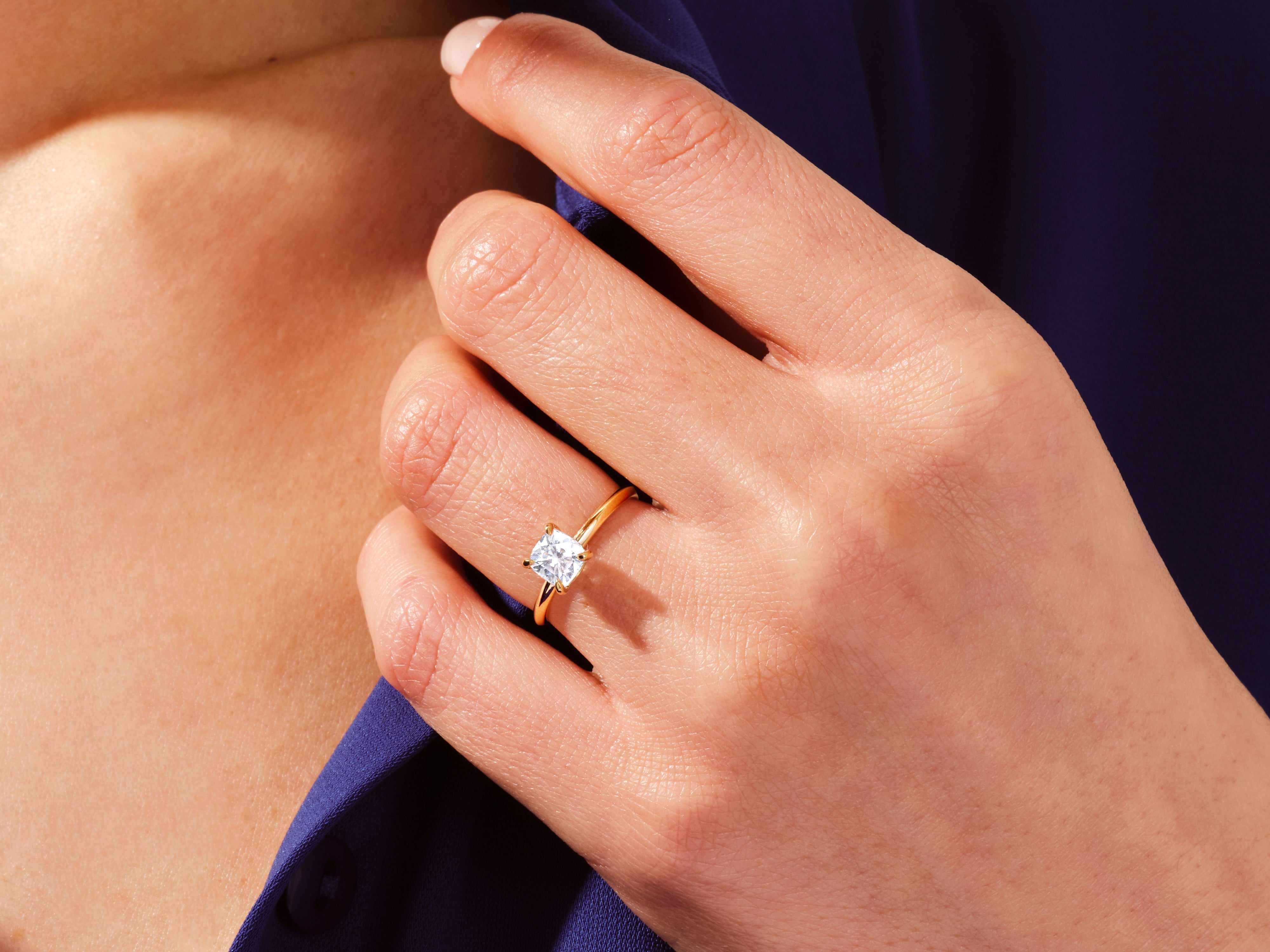 Gold ring with square diamond on hand, jewelry product