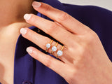 Diamond solitaire rings on a hand, jewelry collection