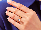 Pear-shaped diamond engagement ring on a woman's hand
