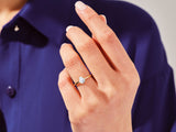 Pear-shaped diamond ring on a hand, jewelry product