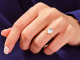 Pear-shaped diamond engagement ring on a hand