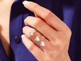 Pear-shaped diamond rings on a hand, jewelry collection