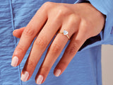 Heart-shaped diamond ring on a woman's finger, jewelry