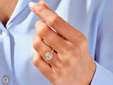Diamond halo engagement ring on a woman's hand