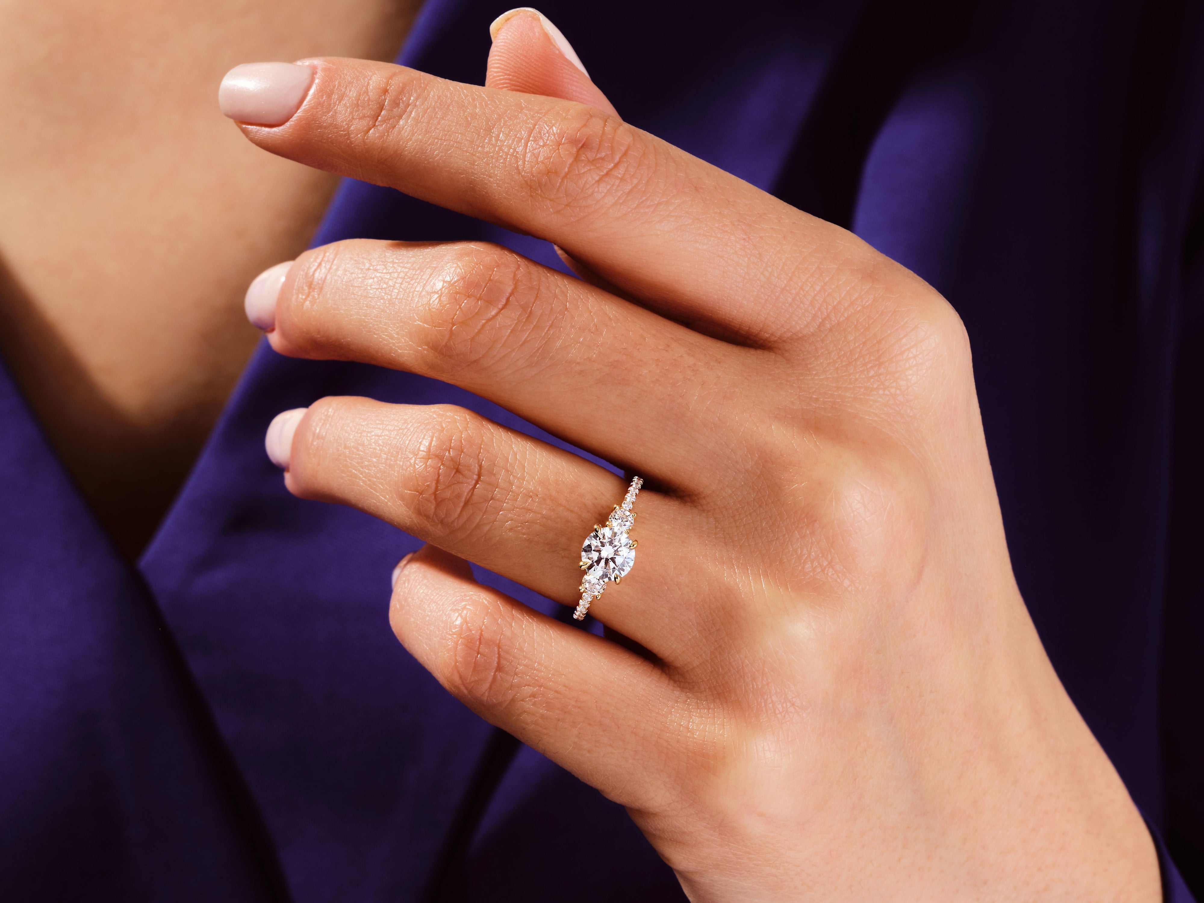 Diamond engagement ring on a woman's hand, jewelry firm product