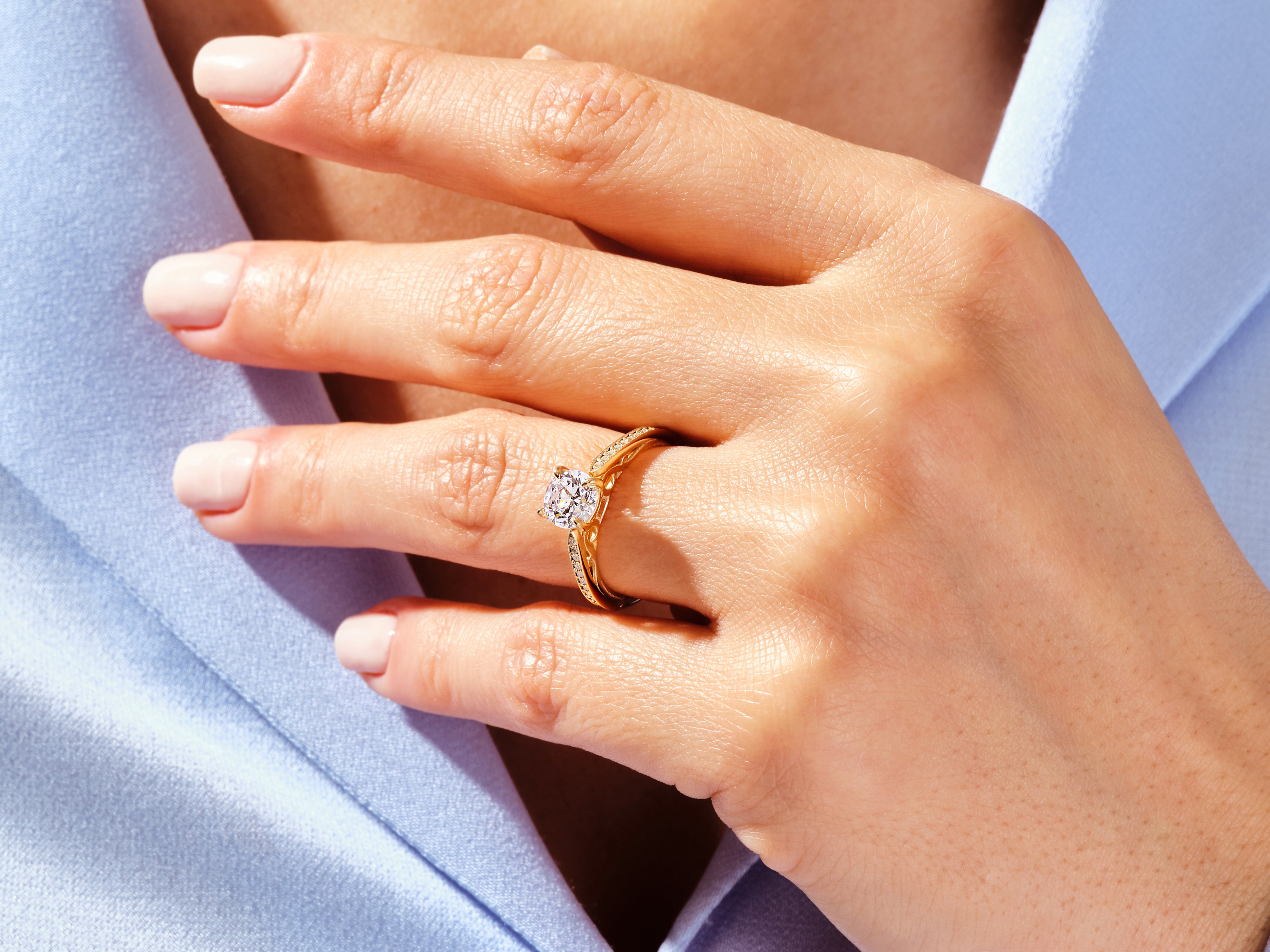 Diamond engagement ring on a woman's hand, fine jewelry