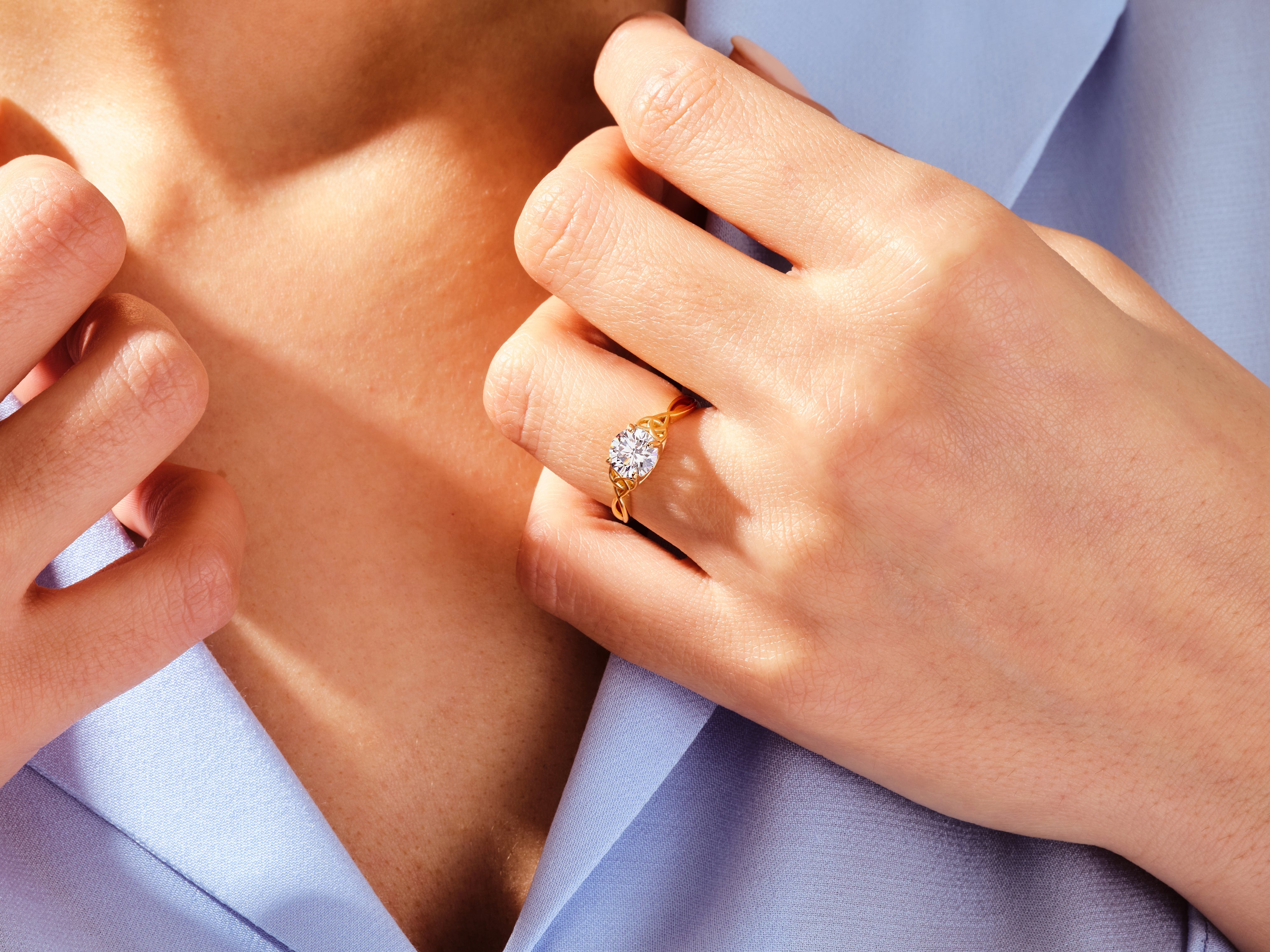 Gold diamond ring on hand, elegant jewelry for women
