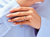 Gold diamond ring on a woman's hand, jewelry product