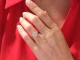 Oval diamond halo ring on a hand, jewelry