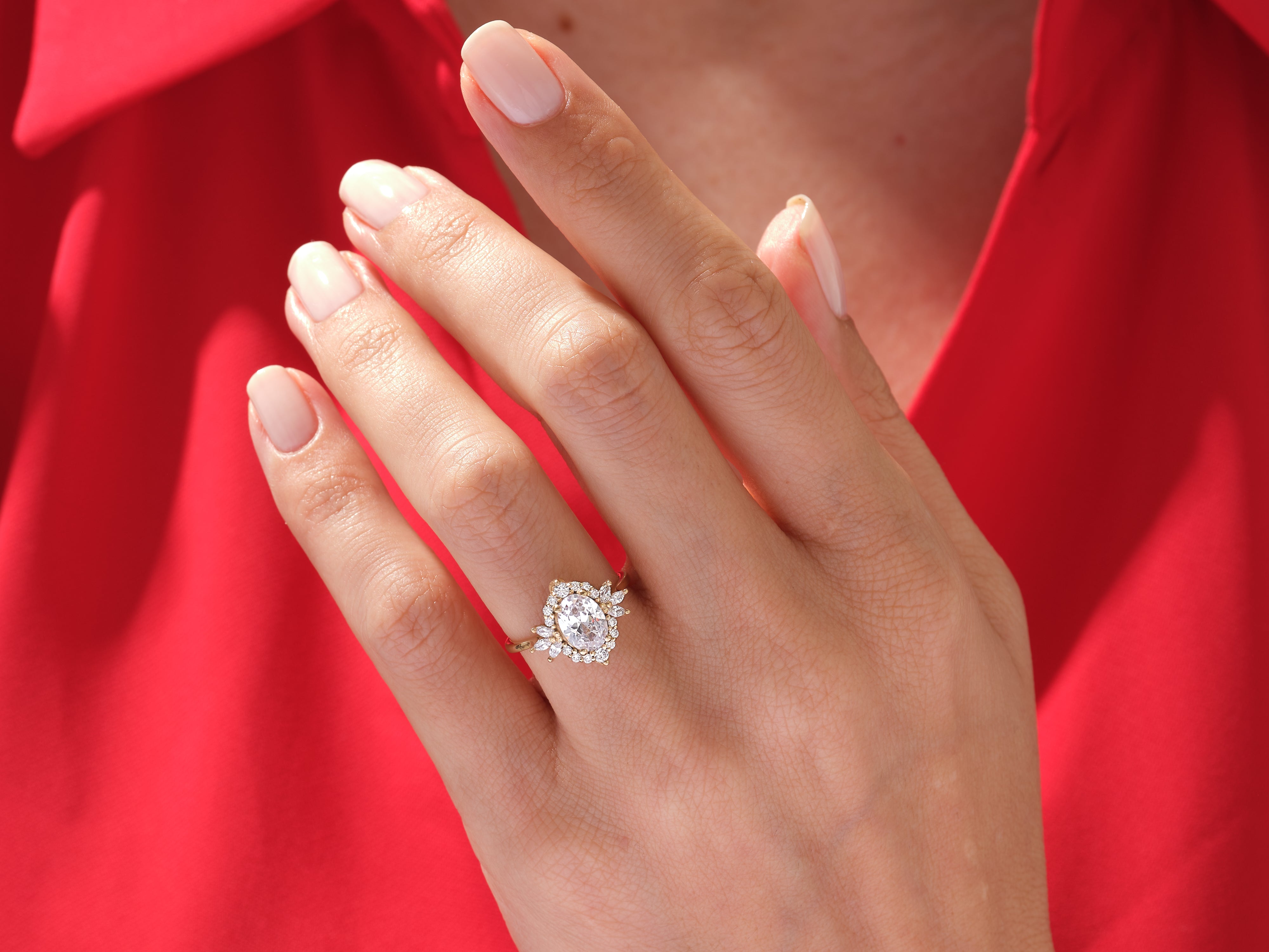 Diamond engagement ring on a hand, jewelry product photography