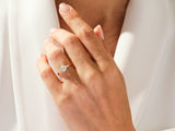 Emerald cut diamond ring on a hand, jewelry firm product