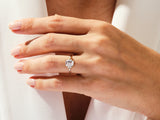 Emerald cut diamond ring on a hand, fine jewelry