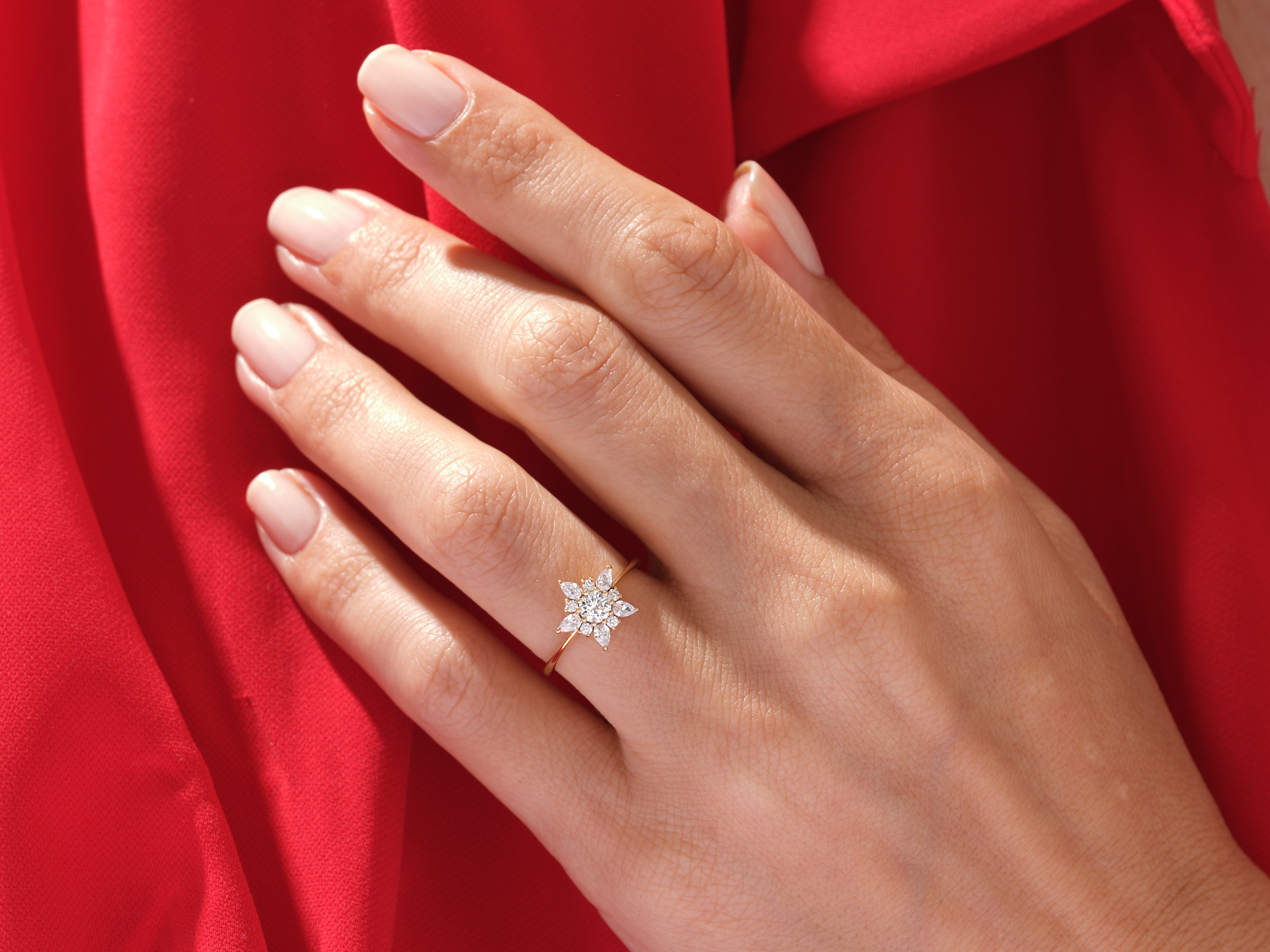 Diamond flower ring on a hand, luxury jewelry