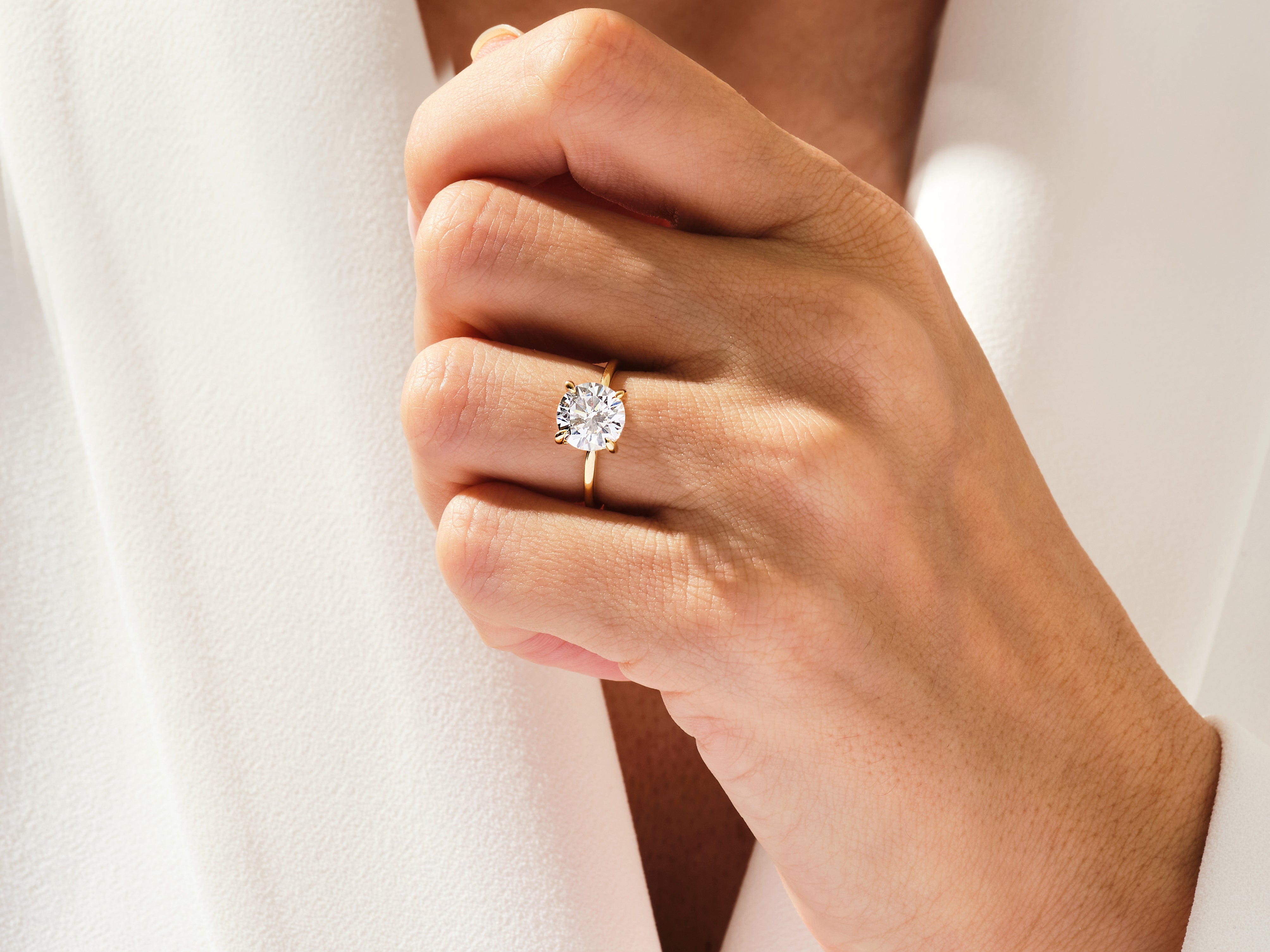 Diamond engagement ring on a woman's hand, jewelry