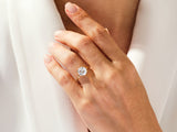 Diamond engagement ring on a woman's hand, jewelry photography
