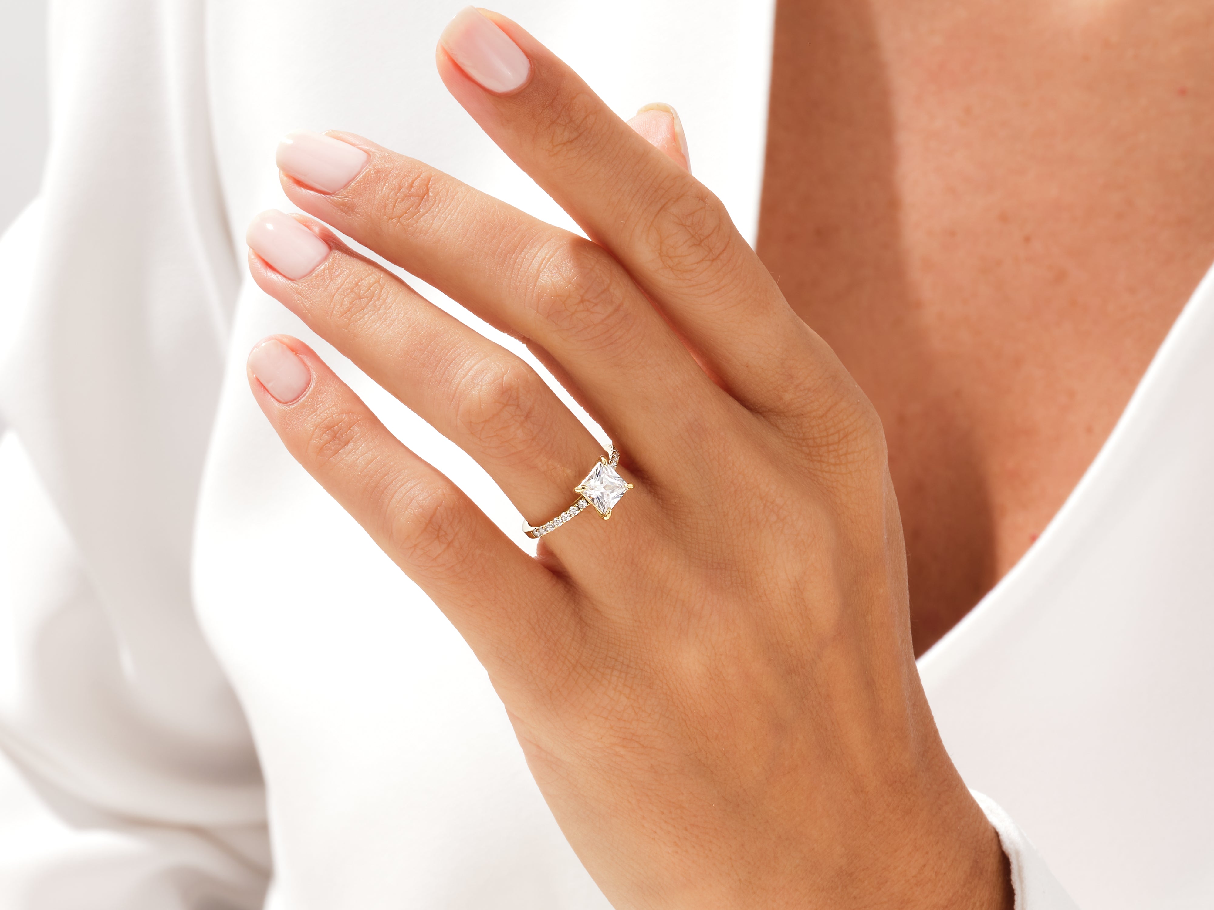 Diamond engagement ring on a woman's hand, luxury jewelry