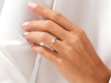 Diamond engagement ring on a woman's hand, jewelry firm product
