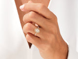 Oval diamond halo ring on hand, fine jewelry