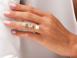 Diamond halo rings on a hand, jewelry collection