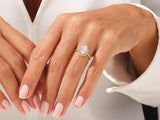Pear-shaped diamond engagement ring on a woman's hand