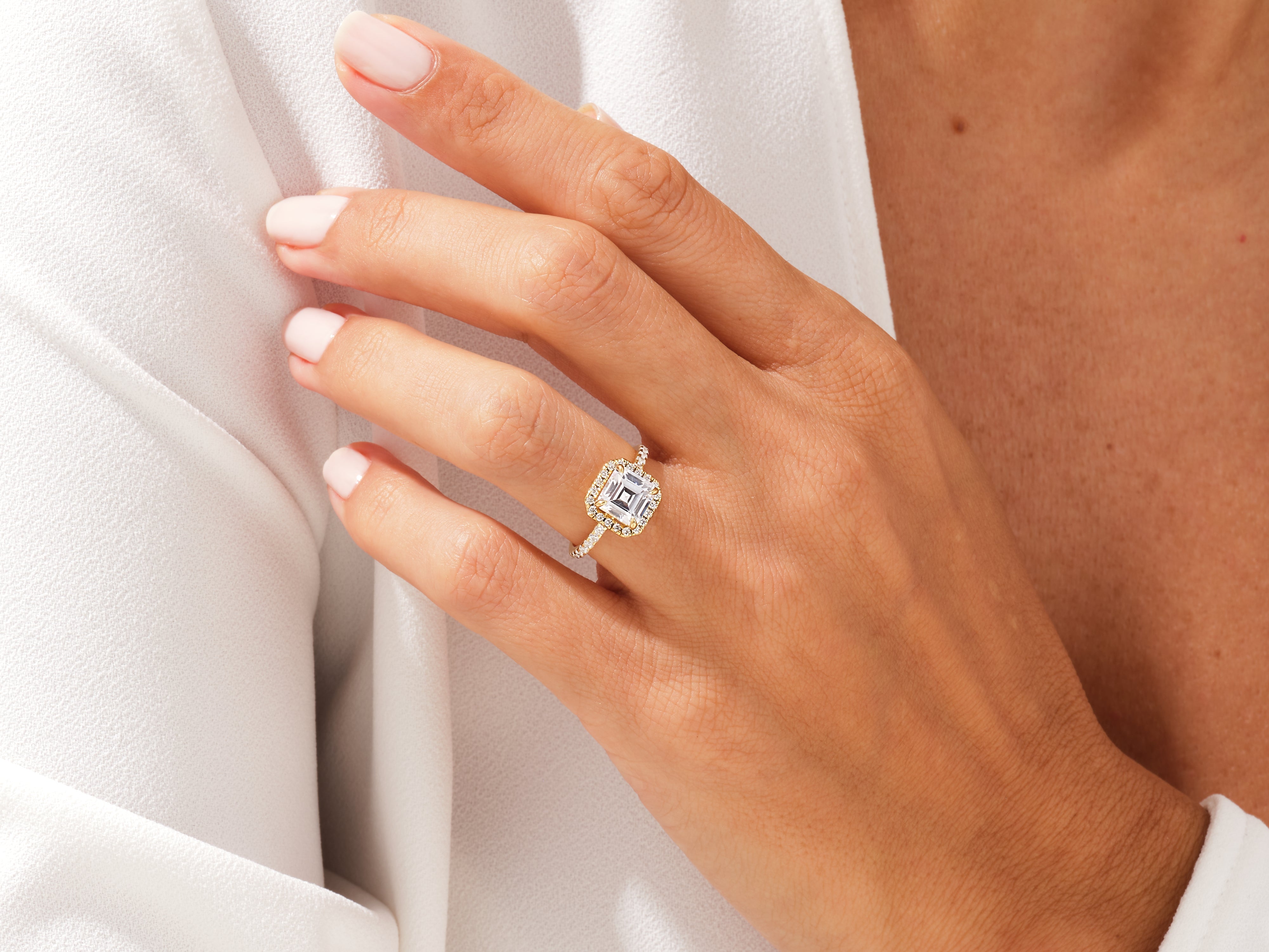 Diamond engagement ring on a woman's hand, luxury jewelry