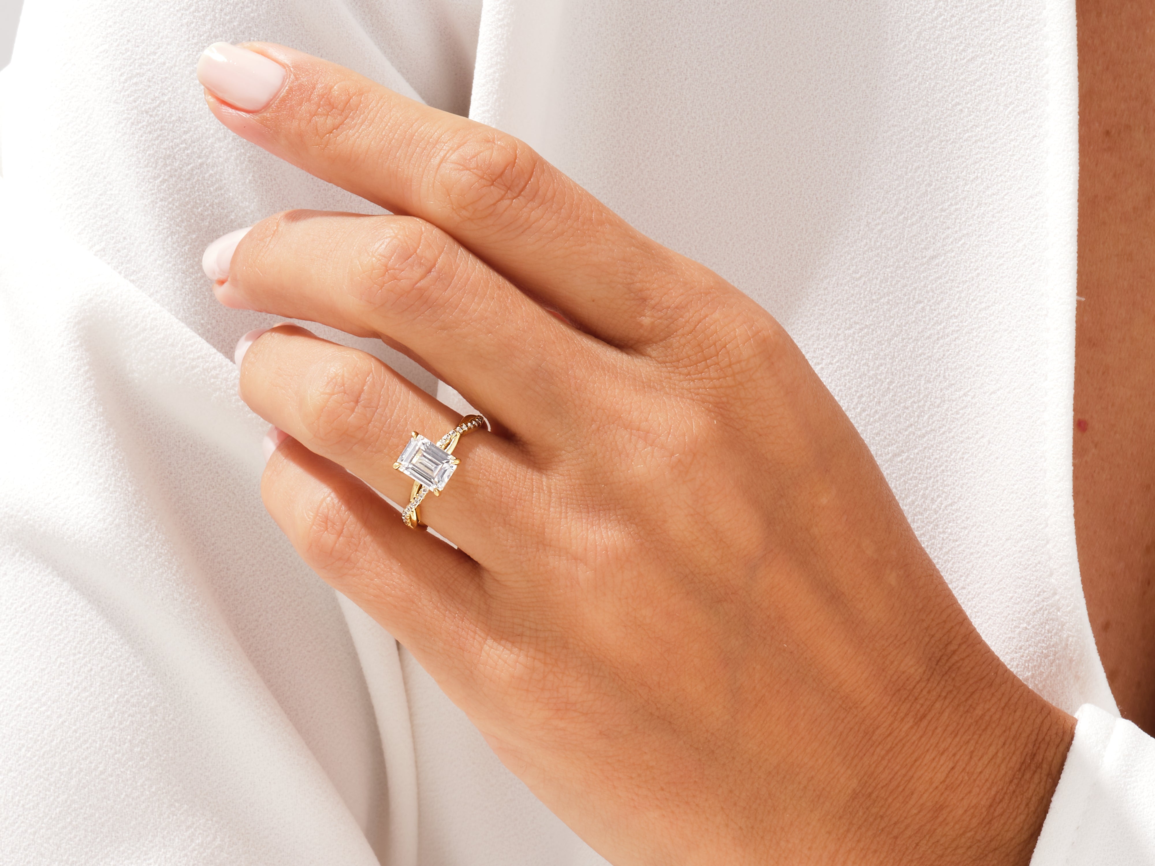 Emerald cut diamond ring with twisted gold band