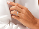 Elegant gold ring with princess-cut diamond on hand