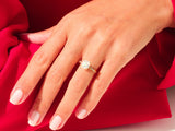 Diamond engagement ring on a hand, luxury jewelry for her