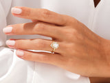 Pear-shaped diamond engagement ring on a woman's hand
