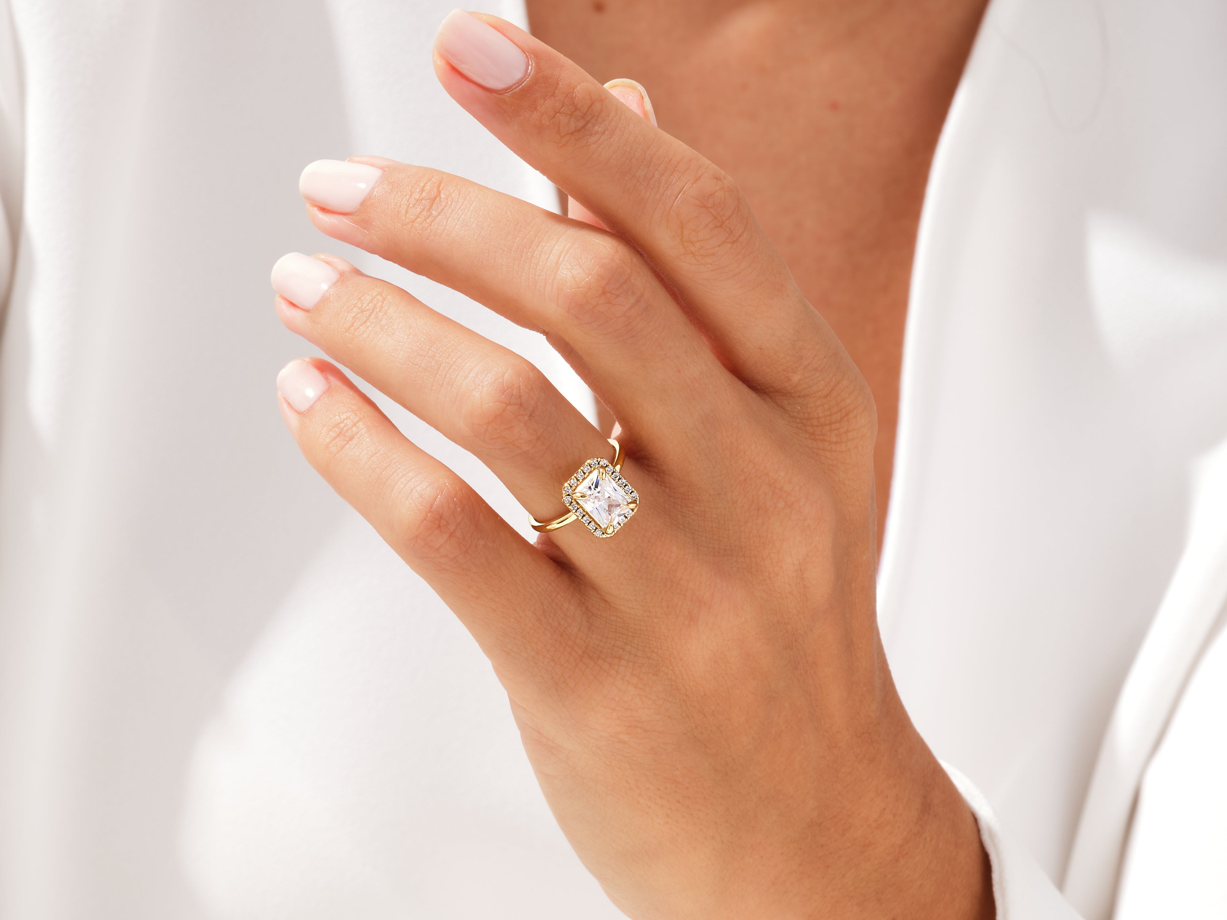 Gold ring with square diamond and halo, jewelry