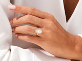 Marquise diamond engagement ring with halo on hand