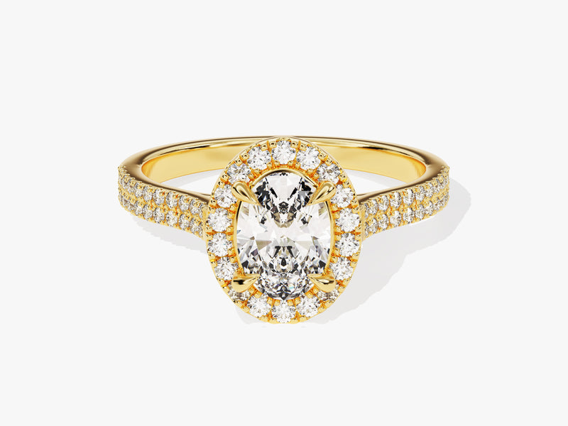 Oval diamond halo engagement ring in yellow gold