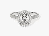 Oval diamond engagement ring with double halo and diamond band
