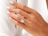 Diamond halo engagement ring on a woman's hand