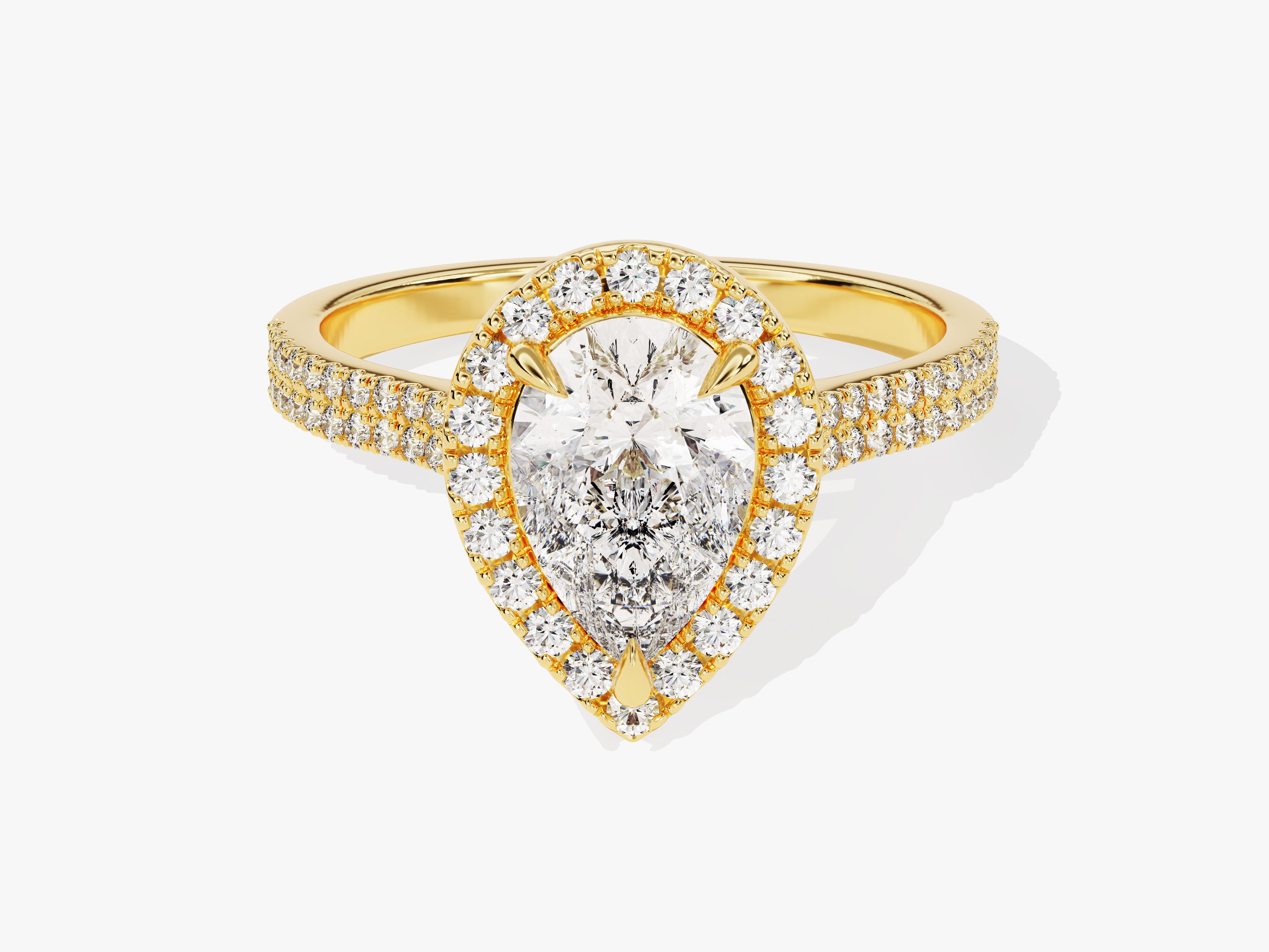 Gold pear-shaped diamond engagement ring with halo and pave band
