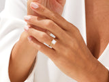 Gold ring with princess cut diamond on hand