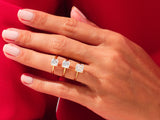 Gold rings with square diamonds on a hand