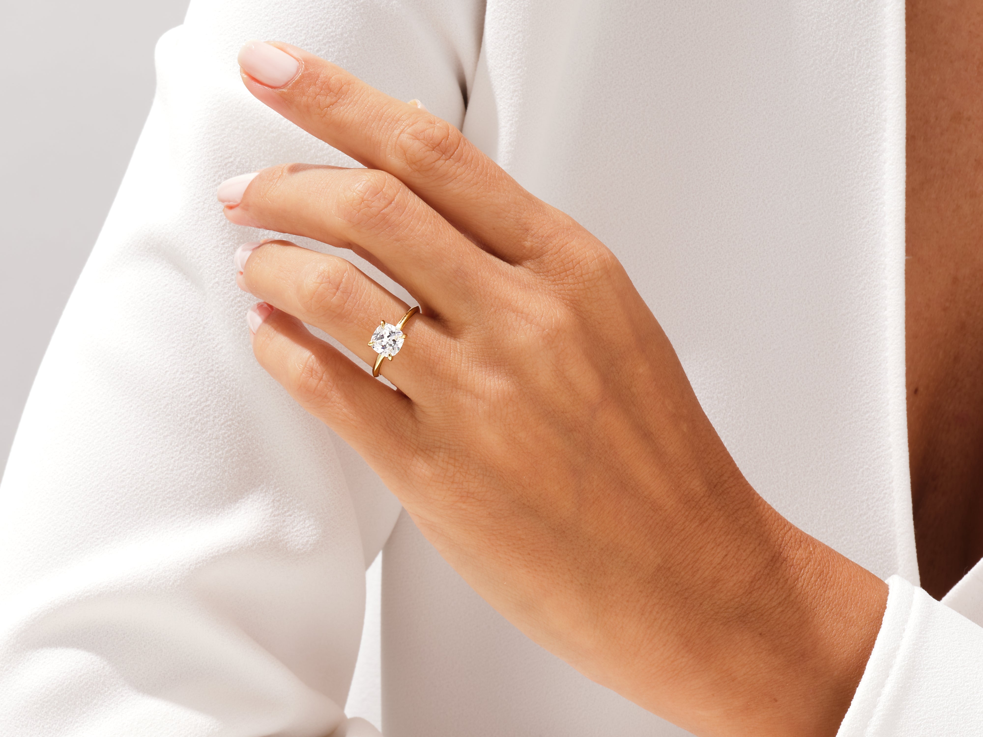 Gold ring with diamond on hand, jewelry product photography