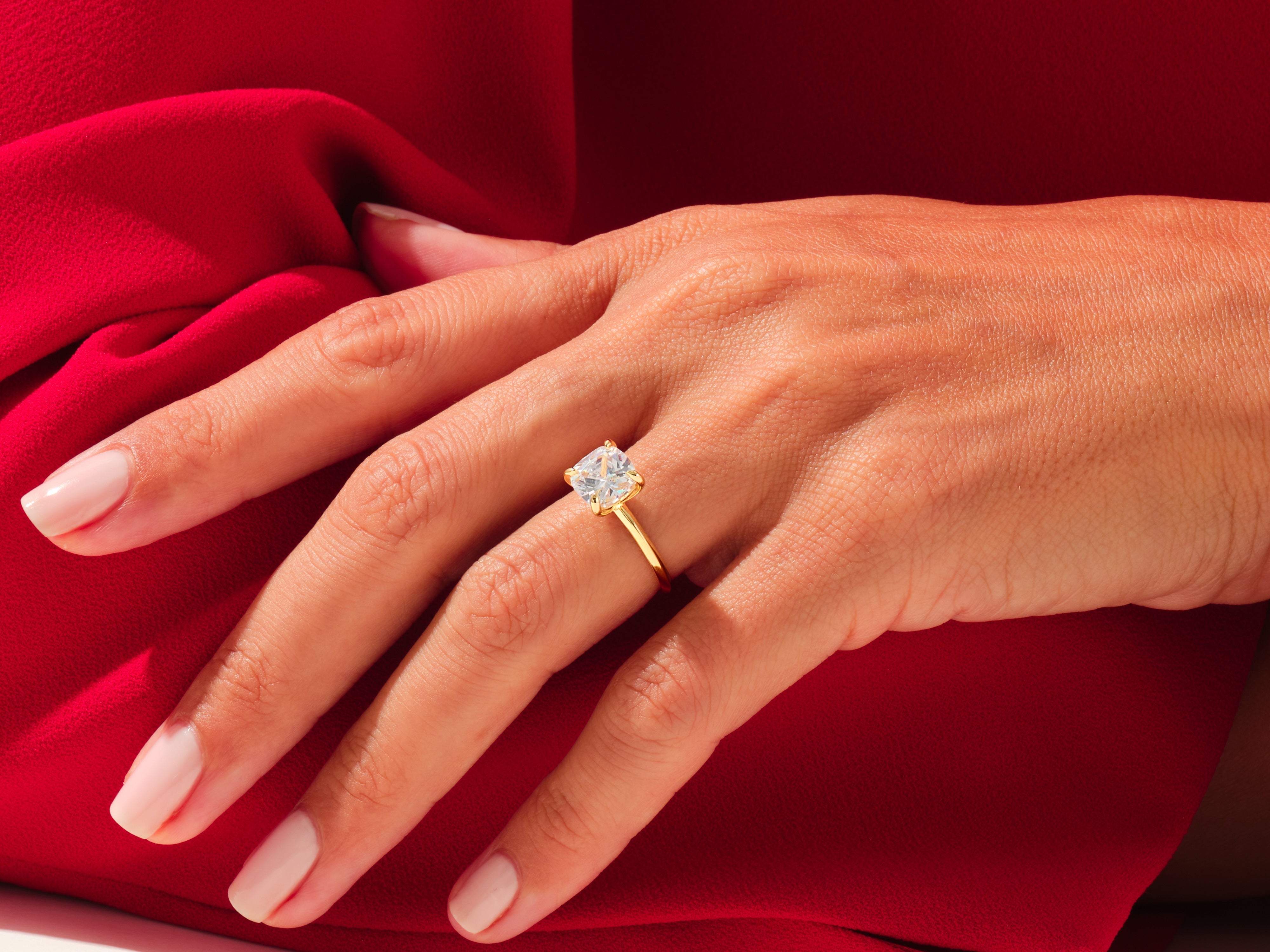 Gold diamond ring on hand, luxury jewelry